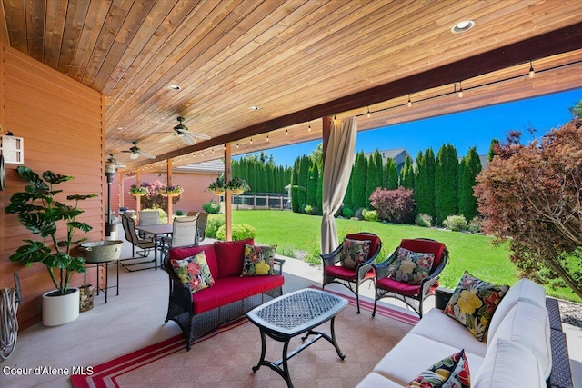 view of patio with outdoor dining space, outdoor lounge area, ceiling fan, and fence