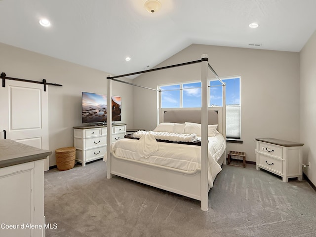 carpeted bedroom with recessed lighting, a barn door, lofted ceiling, and visible vents