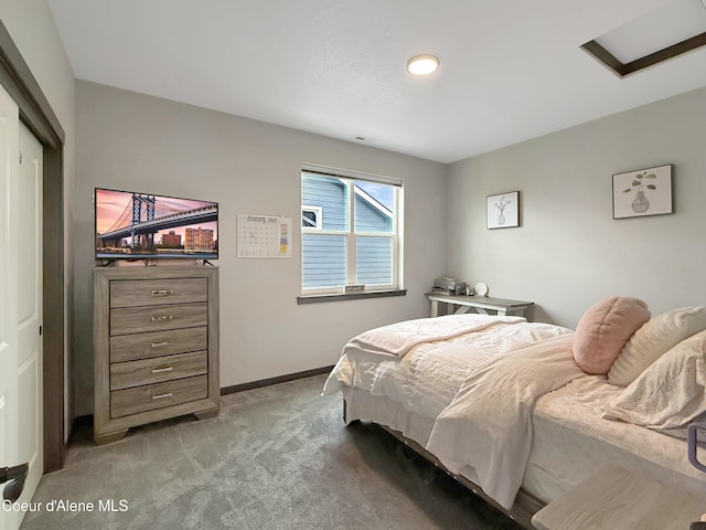 bedroom with visible vents, light colored carpet, attic access, and baseboards