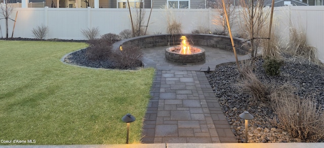 view of yard featuring fence private yard and an outdoor fire pit