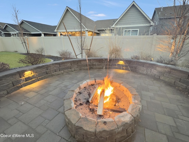 view of patio / terrace with an outdoor fire pit and a fenced backyard