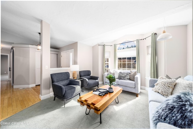 living area featuring baseboards and wood finished floors