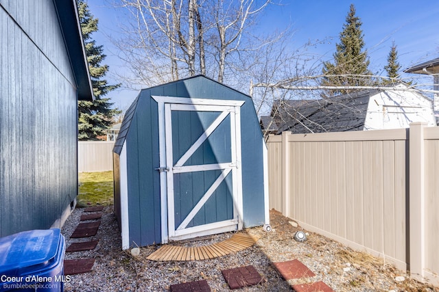 view of shed featuring a fenced backyard