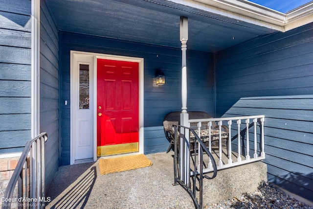 doorway to property featuring a porch