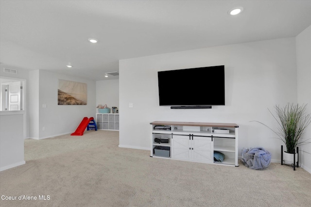 carpeted living room featuring visible vents, recessed lighting, and baseboards