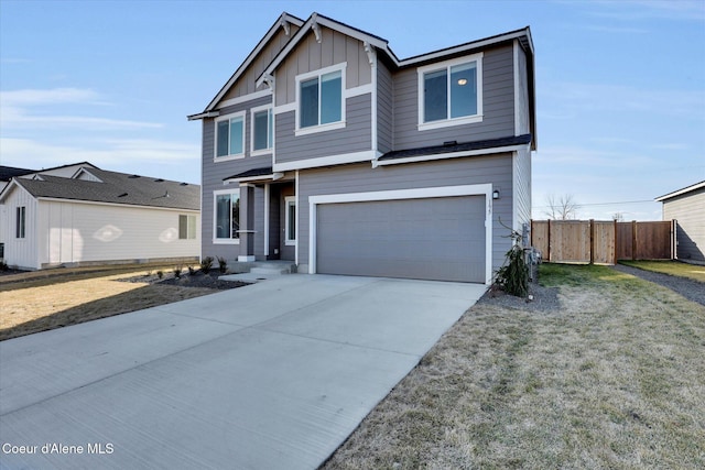 view of front facade featuring board and batten siding, concrete driveway, a garage, and fence