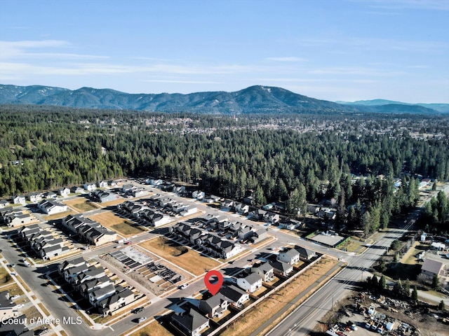 aerial view with a forest view and a mountain view