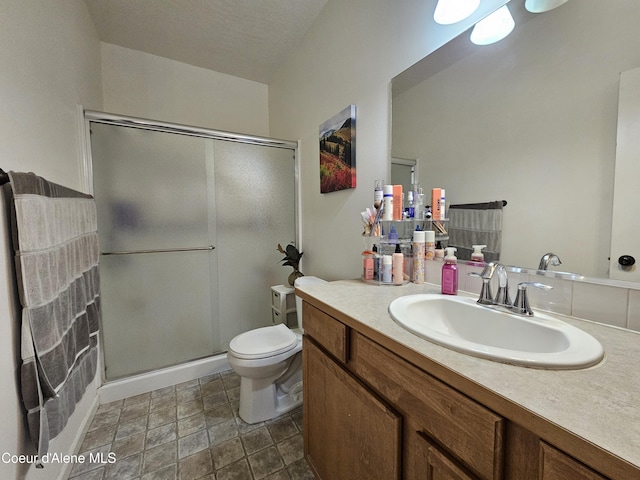 4346 N Brookie Dr, Post Falls, ID 83854 - bathroom with a shower stall, toilet, and vanity