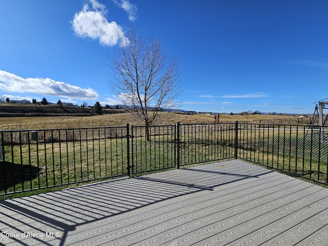 4346 N Brookie Dr, Post Falls, ID 83854 - wooden terrace featuring fence and a rural view