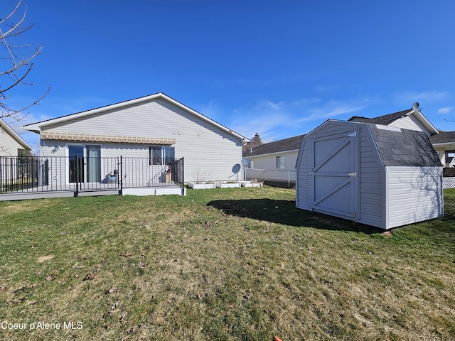 4346 N Brookie Dr, Post Falls, ID 83854 - exterior space featuring a gambrel roof, a shed, an outdoor structure, and a yard