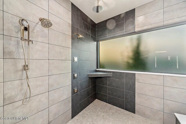 full bathroom with a tile shower