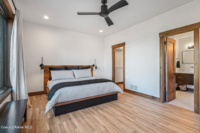 bedroom with light wood-type flooring, visible vents, baseboards, and recessed lighting