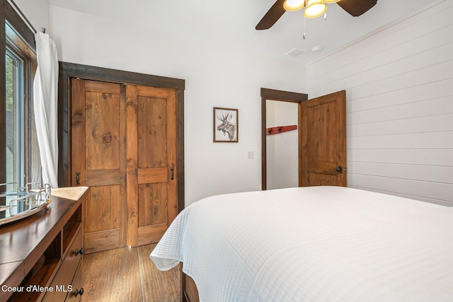 bedroom with wood finished floors and ceiling fan