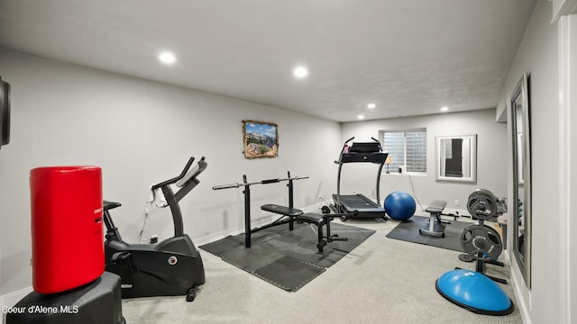 exercise room with recessed lighting, carpet, and baseboards