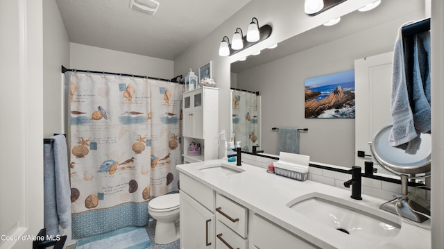 full bathroom featuring double vanity, toilet, visible vents, and a sink