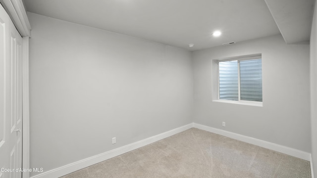 empty room with recessed lighting, visible vents, carpet flooring, and baseboards