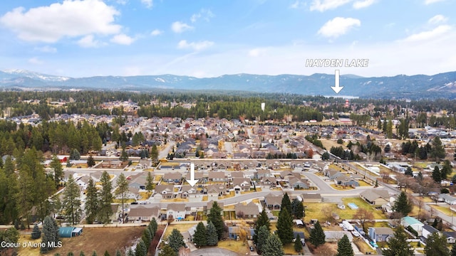 birds eye view of property featuring a mountain view and a residential view