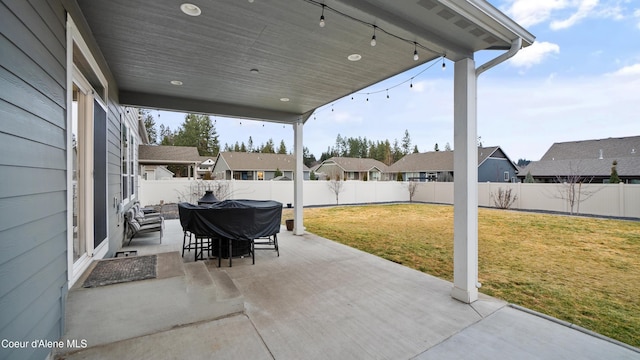 view of patio / terrace with a residential view and a fenced backyard