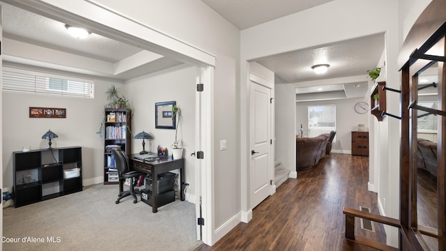 hall with wood finished floors and baseboards