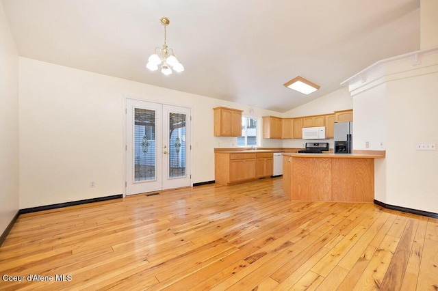 kitchen with white appliances, light wood finished floors, a peninsula, light brown cabinetry, and french doors