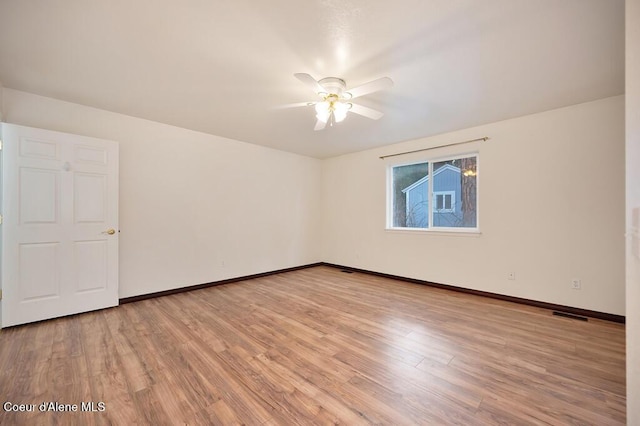 unfurnished room featuring visible vents, baseboards, light wood-type flooring, and ceiling fan