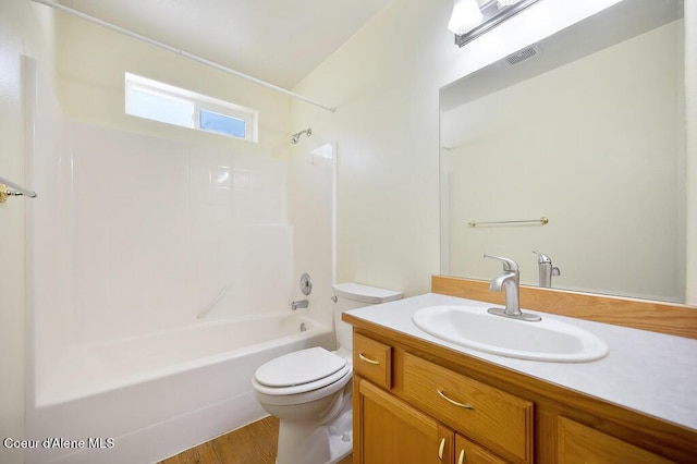 bathroom with bathing tub / shower combination, visible vents, toilet, and vanity