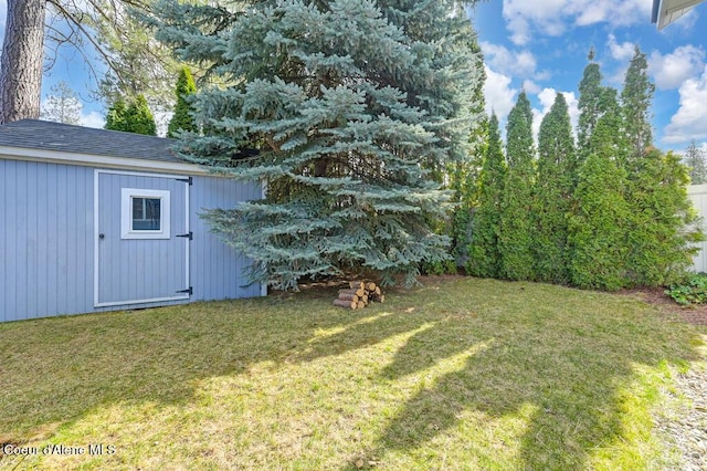 view of yard featuring an outbuilding and a storage shed