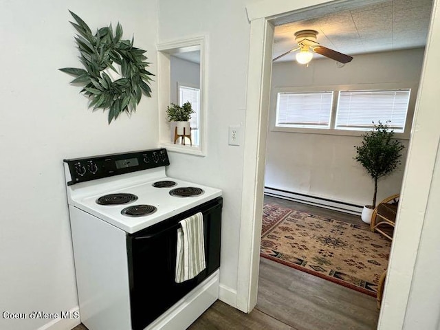 kitchen with dark wood-style floors, baseboard heating, electric stove, and a ceiling fan