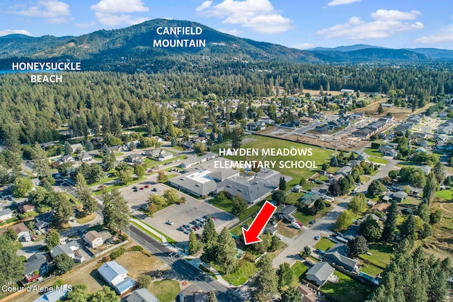 drone / aerial view with a view of trees and a mountain view