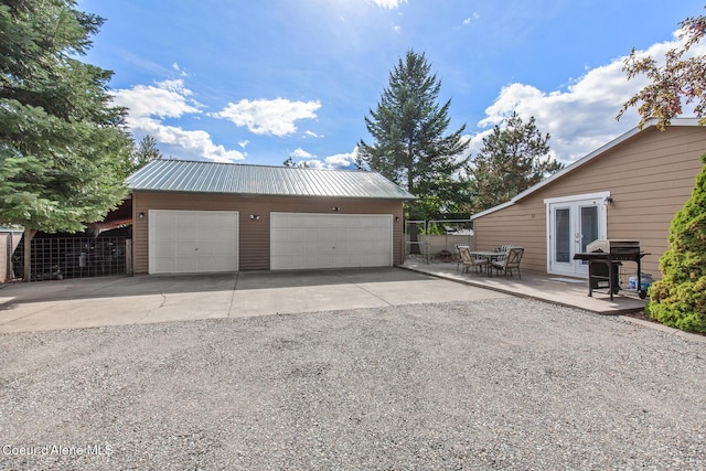 detached garage with french doors and fence