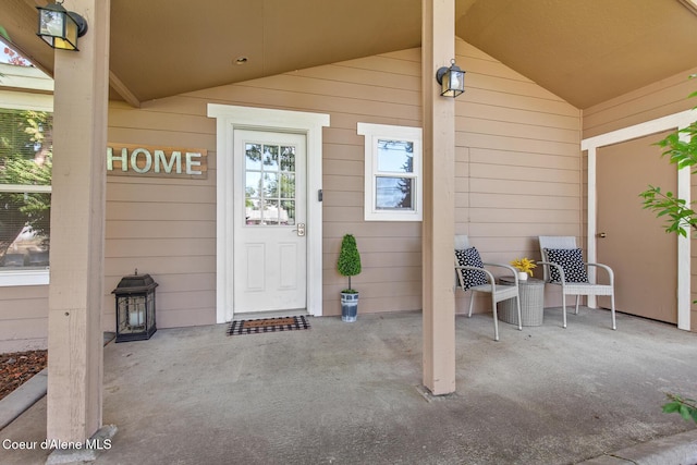 doorway to property with covered porch