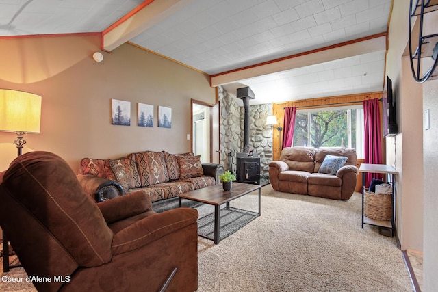 carpeted living area featuring vaulted ceiling with beams and a wood stove