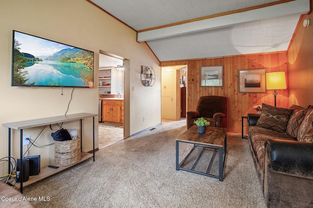 carpeted living room featuring wood walls and vaulted ceiling with beams