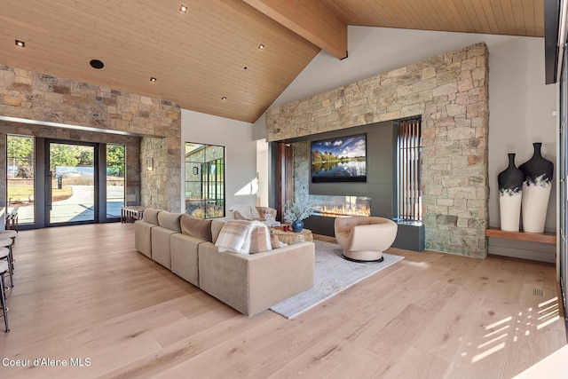 interior space featuring beam ceiling, high vaulted ceiling, wood ceiling, and wood finished floors