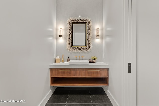 bathroom featuring tile patterned floors, vanity, and baseboards