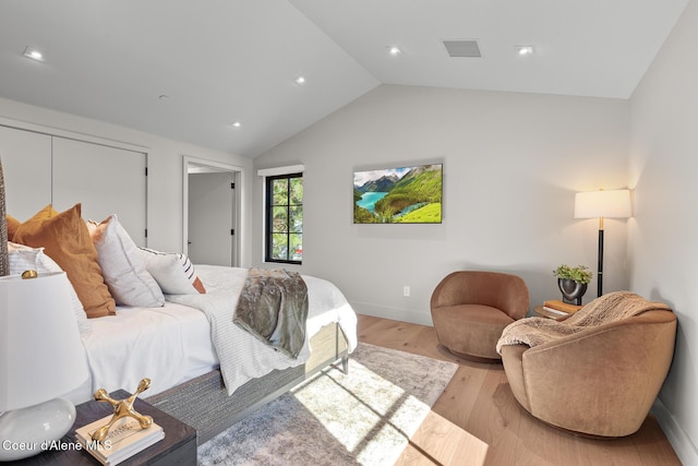 bedroom featuring visible vents, baseboards, recessed lighting, vaulted ceiling, and light wood-type flooring