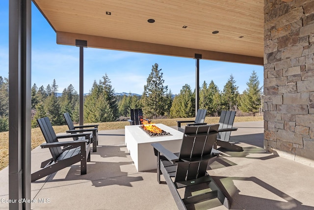 view of patio with an outdoor fire pit