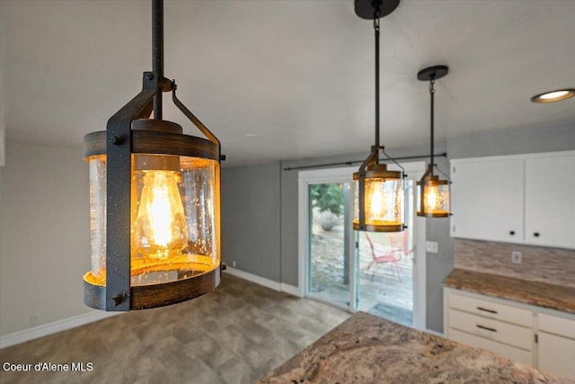 interior details featuring decorative backsplash and baseboards