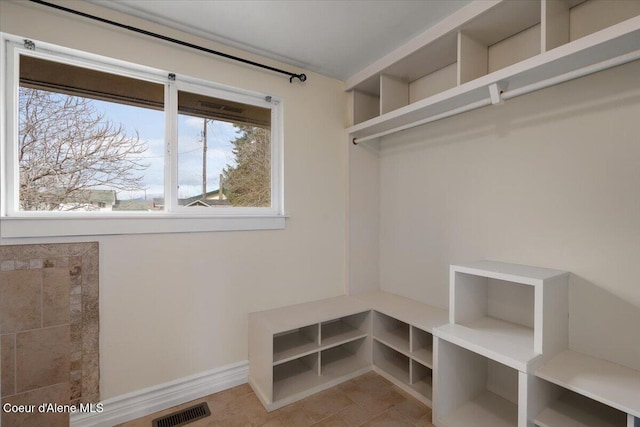 walk in closet featuring visible vents