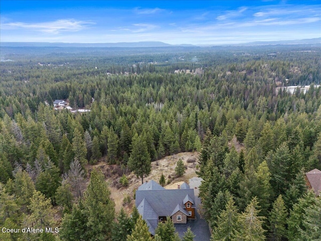 aerial view with a view of trees and a mountain view