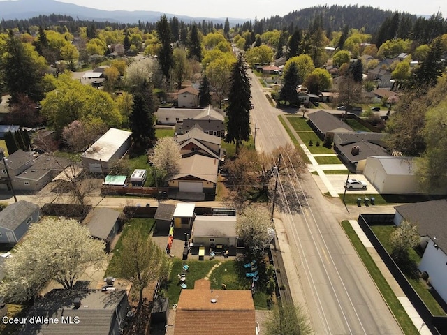 aerial view of property and surrounding area with nearby suburban area