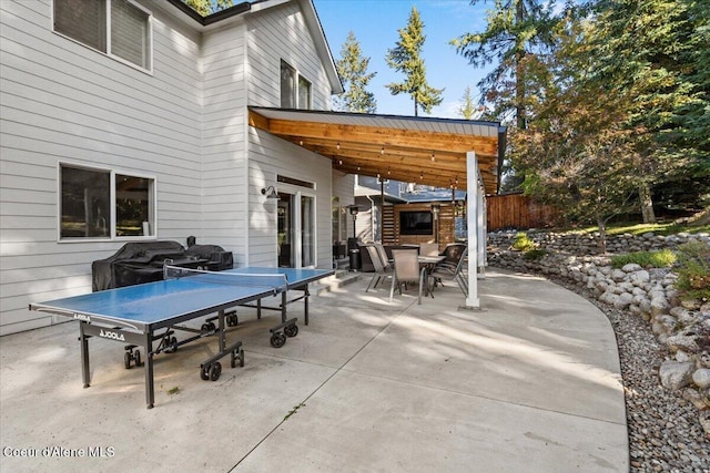 view of patio / terrace with outdoor dining space and fence