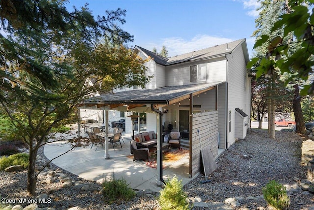 exterior space with an outdoor living space and a patio area