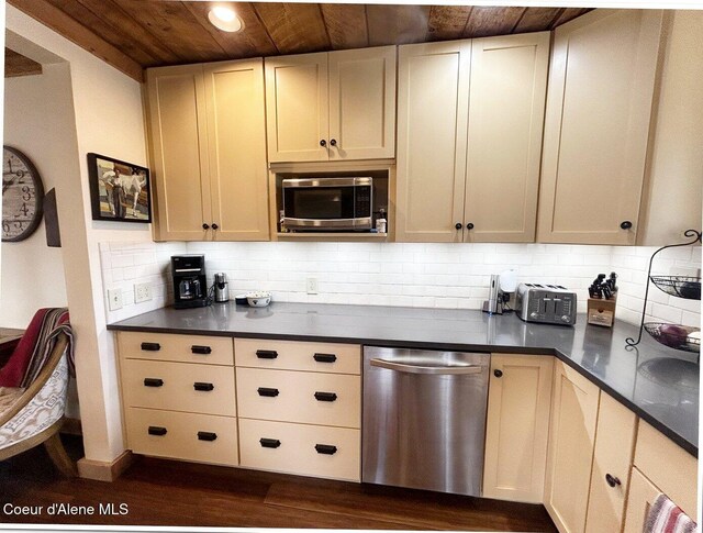 kitchen with dark countertops, wooden ceiling, stainless steel appliances, and dark wood-style flooring