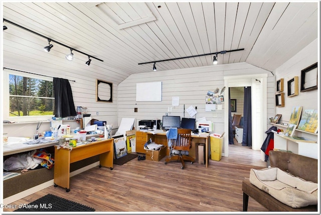 home office featuring wood finished floors, wooden ceiling, track lighting, lofted ceiling, and wooden walls