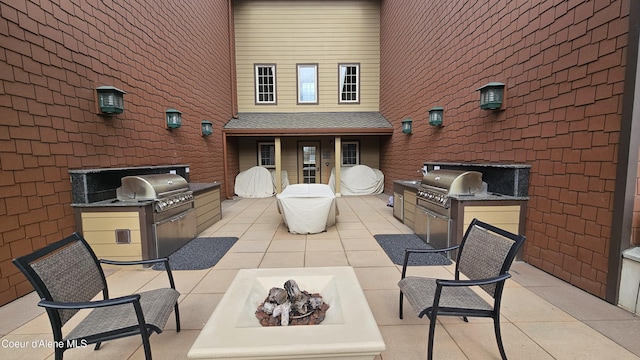 view of patio with area for grilling, an outdoor kitchen, and outdoor lounge area