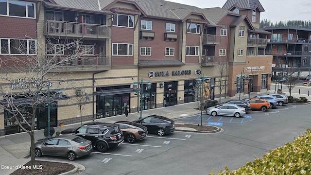 view of property with uncovered parking