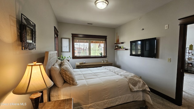 bedroom featuring carpet flooring, baseboards, and visible vents