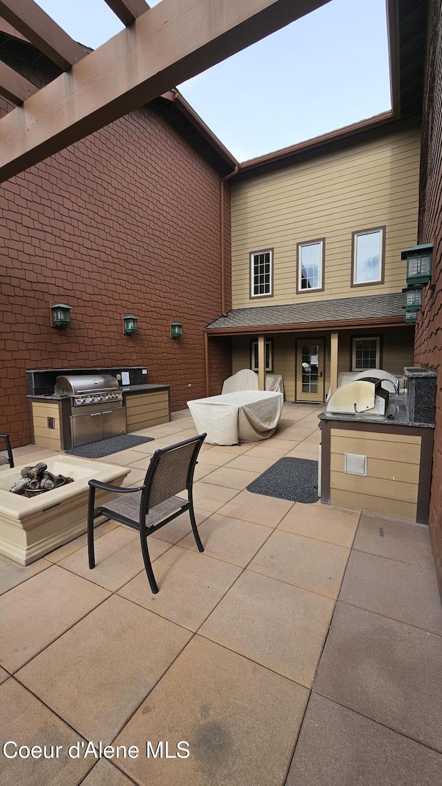 view of patio featuring a grill and exterior kitchen