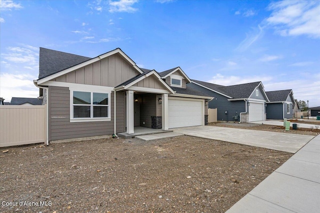 view of front of house featuring concrete driveway, a garage, fence, and board and batten siding